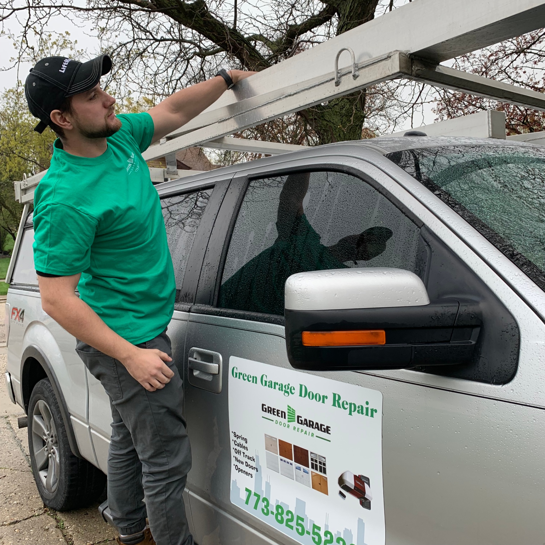 Green Garage Door Repair technician arriving for service in Lighthouse Point, FL